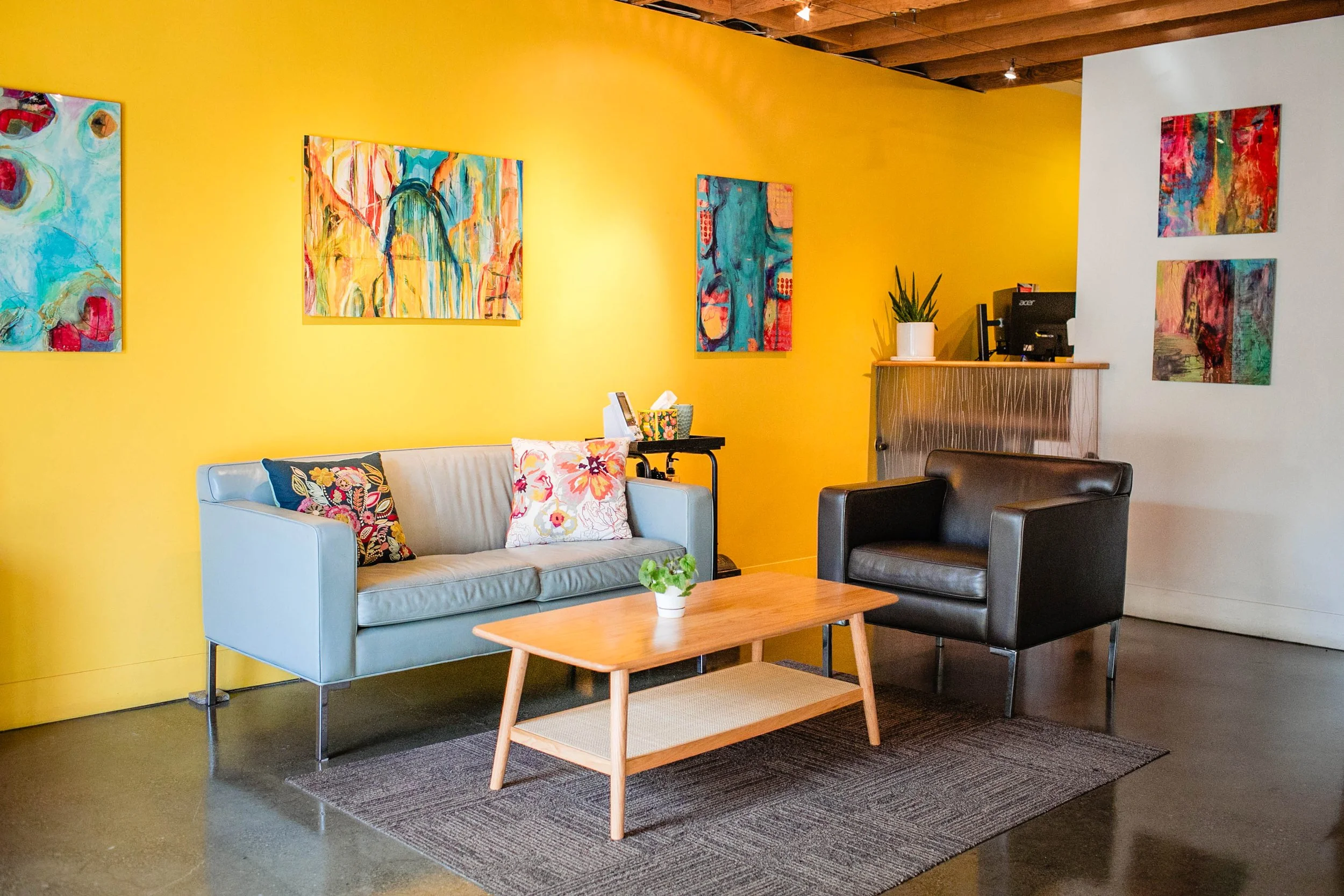 WholeFamily MD waiting room with art and seating